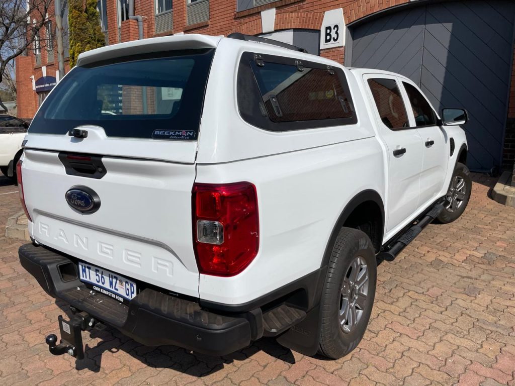 BEEKMAN FIBREGLASS FORD CANOPY WITH TILT UP DOORS